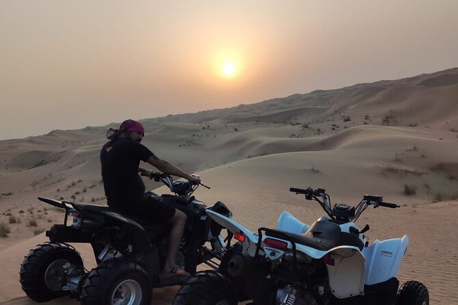 1 hour Quad Biking Experience with pick and drop - Farms, camel sightings, and the changing desert view