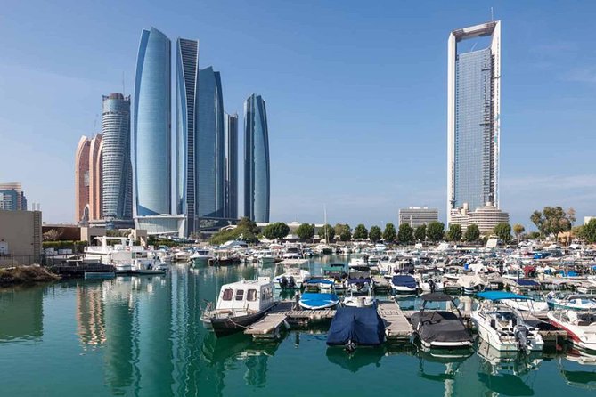 2-Day Abu Dhabi City Tour and Desert Safari with BBQ Dinner - Sand boarding and camel riding keep the program active