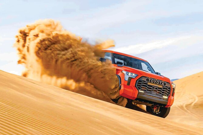 4 Hour Morning Desert Safari with Camel Ride & Sand Boarding - Dune bashing across the high red sand