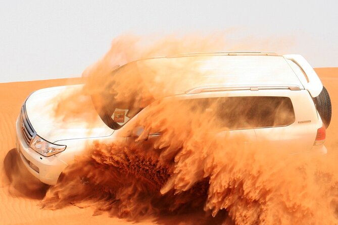 4x4 Arabian Adventure Desert Safari with BBQ Dinner - The red-dune ride and desert driving