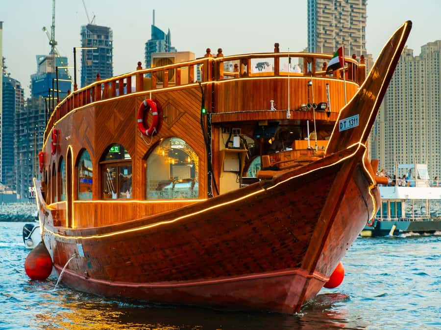 5-Star Marina Dhow Dinner Cruise With Live Entertainment - Boarding a traditional dhow-style boat