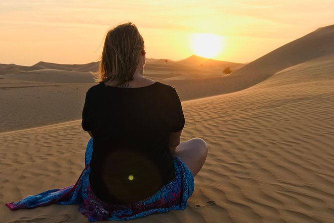 Abu Dhabi Desert safari with BBQ Dinner,Sandboarding & Camel ride - A camel farm adds useful context