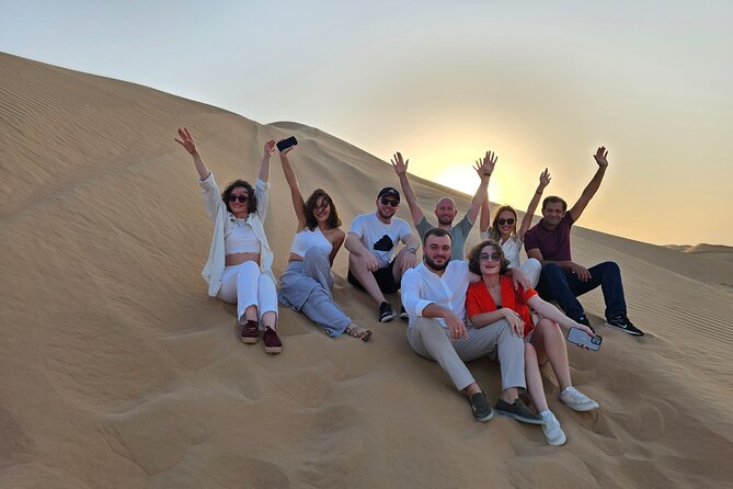 Abu Dhabi Desert Safari With Live Shows And BBQ Buffet Dinner - Sunset, sandboarding, and a first camel ride