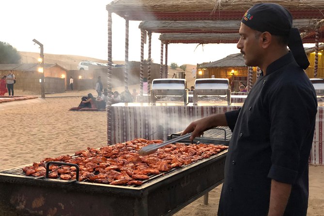 Abu Dhabi Evening Desert Safari with BBQ Dinner and all Camp Activities - Sandboarding and desert photography