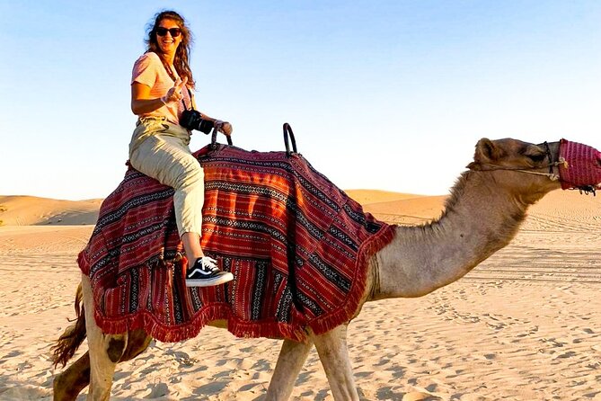 Abu Dhabi: Evening Desert Safari with Camel Ride, BBQ & Live Show - Sunset, sandboarding, and the traditional camp