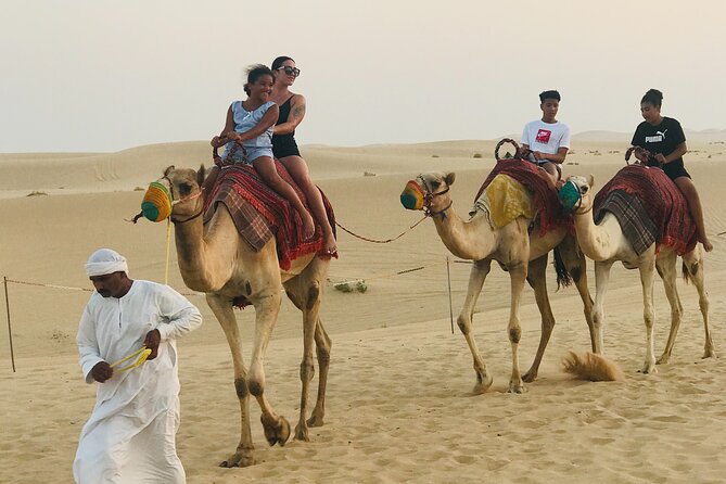 Abu Dhabi Morning Desert Safari,Dune Bashing,Sandboarding,Camel Riding&Quad Bike - A short camel ride at the camp