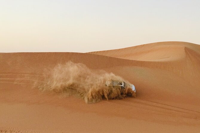 Abu Dhabi Morning Desert Safari,Dune Bashing,Sandboarding,Camel Riding&Quad Bike - Dune bashing across Abu Dhabi’s sand