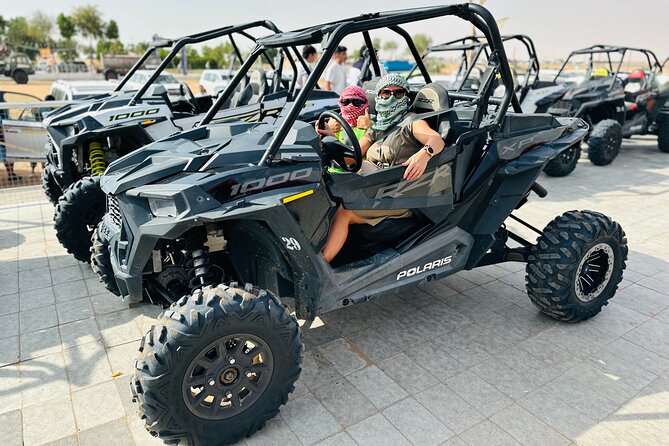 Best Dubai Desert Safari with Buffet Dinner,Sand Boarding & Shows - Sunset, camels, and a short camp welcome