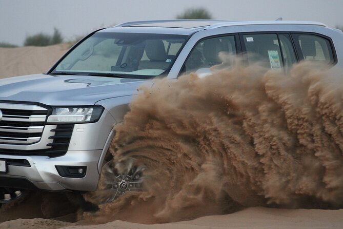 Desert Adventure: Sunset Safari, BBQ Feast & Sandboarding Thrill - The shared 4x4 ride and desert arrival