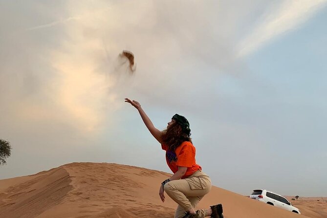 Desert Safari and Sandboarding with Dinner in Dubai - Camel Ride and Traditional Photo Stop