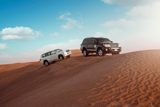 Desert Safari Dubai with Dune Bashing, Sandboarding, Camel Ride, 5 Shows, Dinner - Sandboarding and the Camel Ride