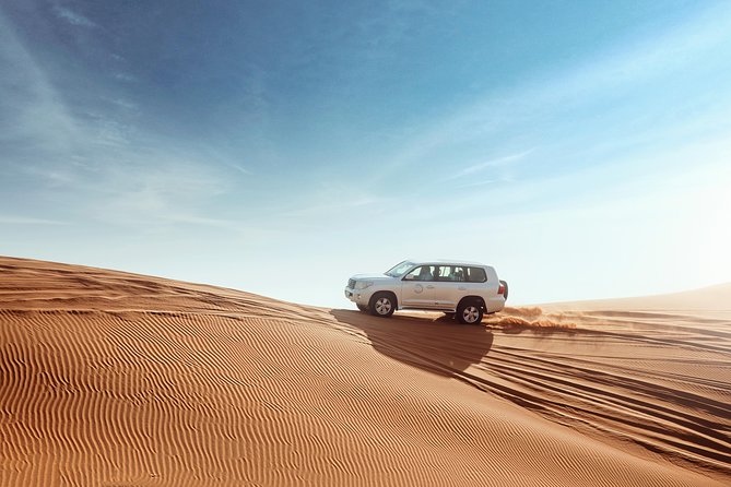 Desert Safari Dubai with Dune Bashing, Sandboarding, Camel Ride, 5 Shows, Dinner - Camp Welcome, Henna, and Arabic Dress Photos