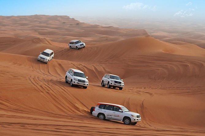 Desert Safari in 4X4 through Lahbab Desert with BBQ Dinner - Camel riding, henna, and the camp stop