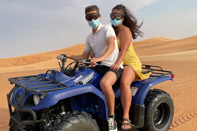 Desert Safari, Quad Biking (30 mins) & VIP BBQ Dinner Experience - Red dunes, dune driving, and sandboarding