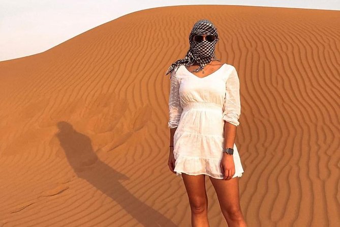 Desert Safari Red Dunes with Camel Ride, Sandboard, BBQ and Shows - Henna, Arabic clothing, and sheesha