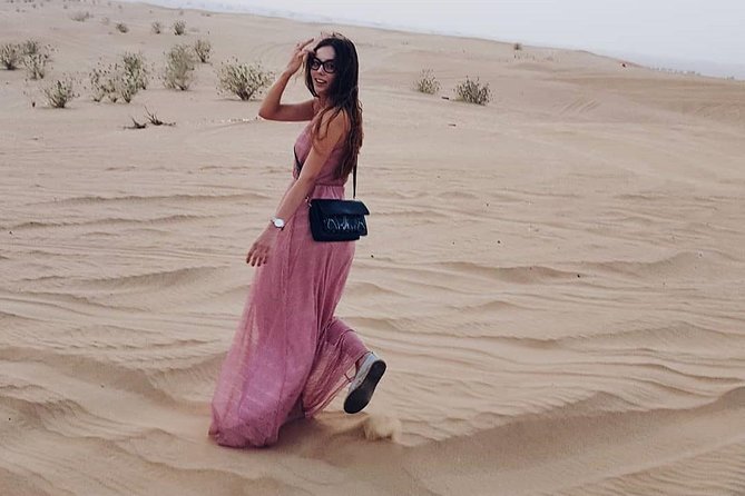 Desert Safari Red Dunes with Camel Ride, Sandboard, BBQ and Shows - Tanoura, belly dance, and fire performances
