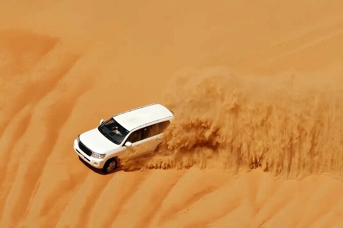 Desert Safari Redsand Dunes with BBQ Dinner in Dubai - Dune bashing in a Toyota Land Cruiser