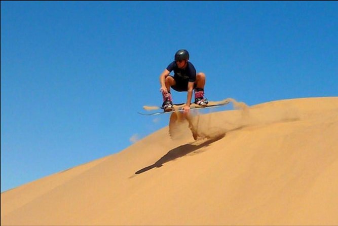 Desert Safari Tour, 6 Hour Fun, Family & Friends, Camel Ride & Dinner Included - Sandboarding and sunset photos at Lahbab