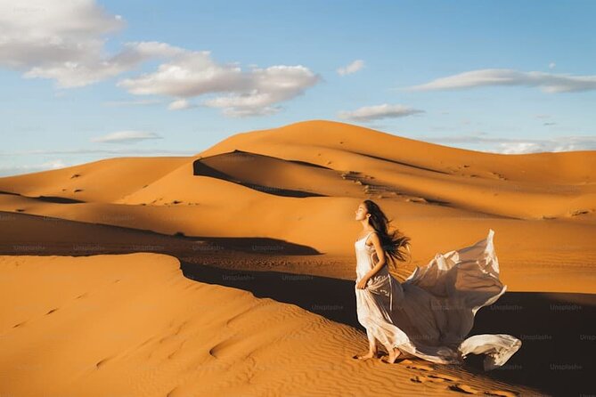 Desert Safari with BBQ Dinner, Camel Ride, Sand Board & Live Show - Four hours at Dubai Leisure Desert Camp
