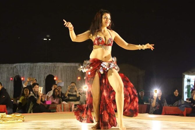 Desert Safari with BBQ Dinner, Camel Ride, Sand Board & Live Show - Henna, Arabic dress, and photographs