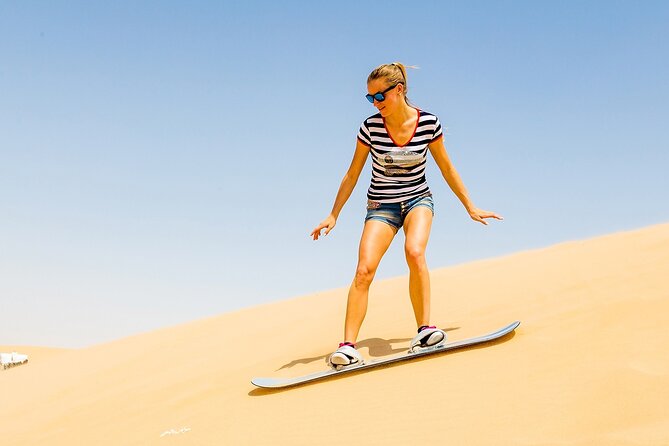 Desert Safari with BBQ Dinner, Camel Ride, Sand Board & Live Show - A practical pause before the action