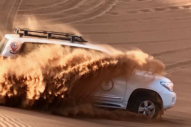 Desert Safari with BBQ Dinner - UAE Must Do - Sandboarding and desert photo stops
