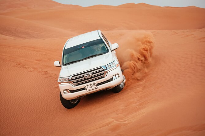 Desert Safari with Dune bashing BBQ Dinner and More Activities - Red Sands dune bashing is the main event