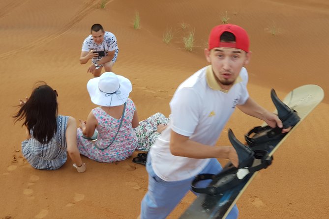 Dubai 4x4 Desert Safari, Quad Bike, Camel Ride & BBQ Dinner - Sandboarding and the sunset photo stop