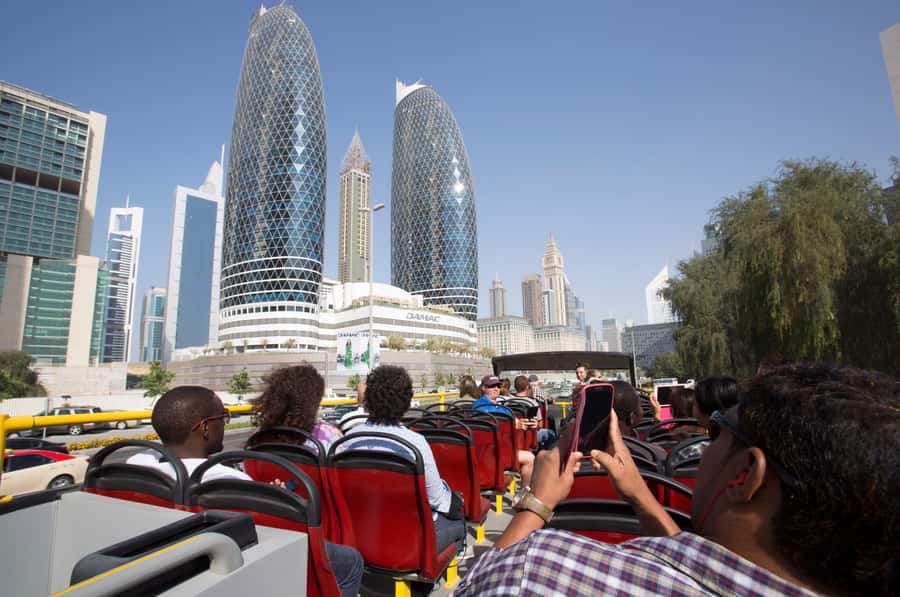 Dubai: City Sightseeing HOHO Bus Tour + Sunset & Night Tour - Commentary, comfort, and small practical details