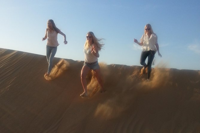 Dubai Desert Afternoon Quad Safari with Camel Ride, BBQ Dinner and Belly Dancing - BBQ dinner, belly dancing, and tanoura performance