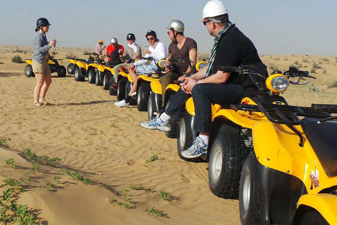 Dubai Desert Afternoon Quad Safari with Camel Ride, BBQ Dinner and Belly Dancing - Riding the dunes on an automatic quad bike