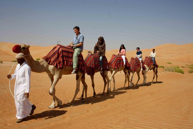 Dubai: Desert Camel Ride with Live Shows & BBQ Buffet Dinner - Leaving Dubai for the Red Dunes