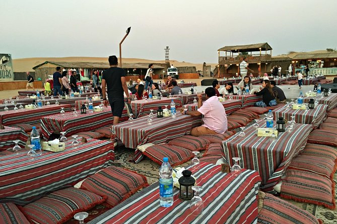 Dubai: Desert Camel Ride with Live Shows & BBQ Buffet Dinner - BBQ dinner beneath the evening sky