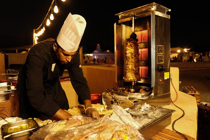 Dubai Desert Camp Dinner with BBQ, Dinner, Camel Ride & Shows - Belly dancing, Tanura, and fire under the stars