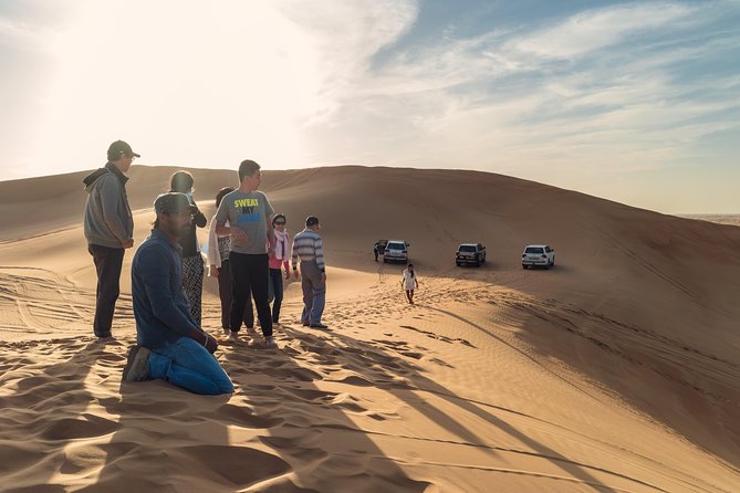Dubai Desert Discovery: Red Dunes Safari, Sandboard & Camel Ride - Sandboarding Down the Slopes