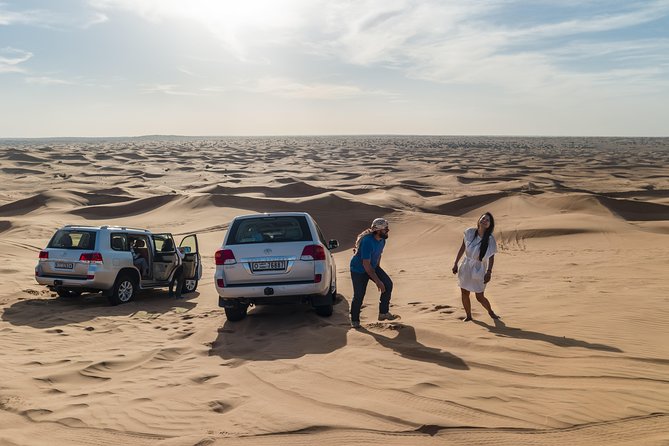 Dubai Desert Discovery: Red Dunes Safari, Sandboard & Camel Ride - Afternoon Sunset or a Morning Desert Start