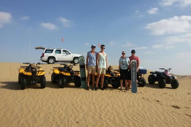 Dubai Desert Morning Tour in 4WD Vehicle: Camel Ride, Quad Bike Tour, Sandboarding, and Camel Farm - Quad Biking Across the Sandy Tracks