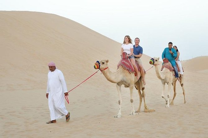 Dubai Desert Safari: An Arabian Desert Experience - Camel riding adds the old desert image