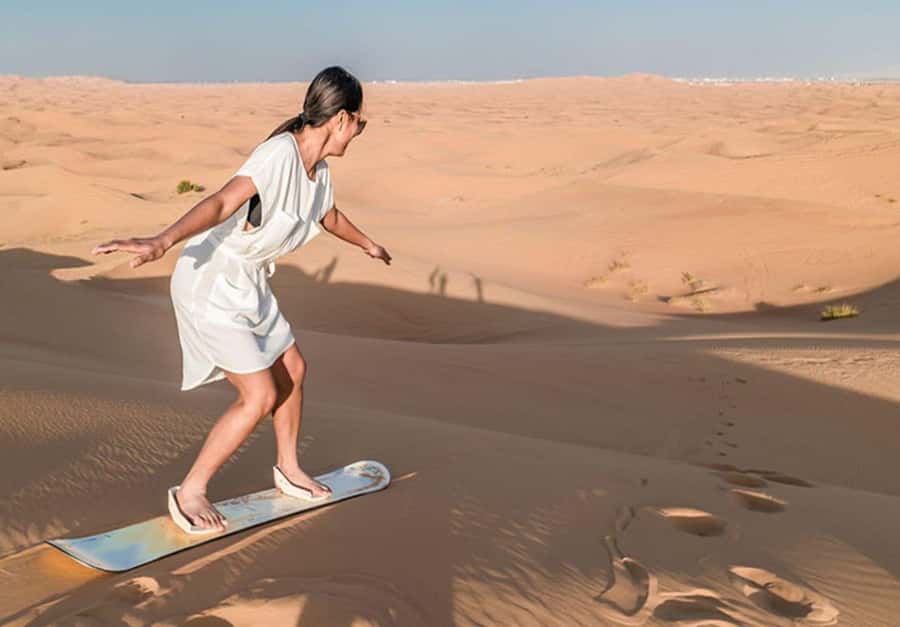 Dubai: Desert Safari Camel Riding, Sandboarding & BBQ Dinner - From Dubai streets to open sand
