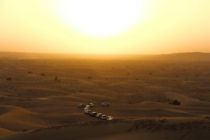 Dubai Desert Safari Dune Bashing, Camel Ride, Sandboarding & BBQ - Dune bashing in a 4x4