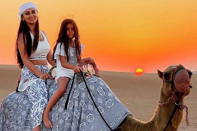 Dubai Desert Safari: Dune Drive Camel & 5<em> BBQ Shows Stargazing – Key points to know before booking’ /></p>
<ul>
<li><strong>Red dunes in Lahbab:</strong> The main driving section lasts about 15 minutes and includes a separate sunset photo stop.</li>
<li><strong>Shared Land Cruiser transport:</strong> Pickup and drop-off are included, with a maximum of six people per vehicle.</li>
<li><strong>Several activities included:</strong> You get a short camel ride, sandboarding, henna for women and girls, Arabic costume photos, and refreshments.</li>
<li><strong>Optional motorized activities:</strong> Quad bikes and dune buggies are available at an extra charge for at least 30 minutes.</li>
<li><strong>Dinner and entertainment:</strong> The camp serves a BBQ buffet with vegetarian choices, followed by belly dance, Tanoura, and fire performances.</li>
<li><strong>Important seating detail:</strong> Dedicated tables near the entertainment may require an additional payment.</li>
</ul>
<h2 id="leaving-dubai-for-lahbabs-red-dunes">Leaving Dubai for Lahbab’s red dunes</h2>
<p><img width="669" height="446" decoding="async" src=