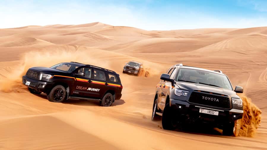 Dubai Desert Safari - Premium BBQ Dinner, Camel Ride & Shows - Tanoura, fire, and belly dance after sunset