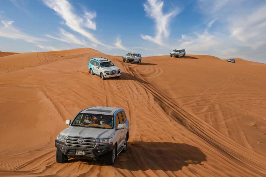 Dubai: Desert Safari, Quad Bike, Camel Ride & Al Khayma Camp - What the guides add to the experience