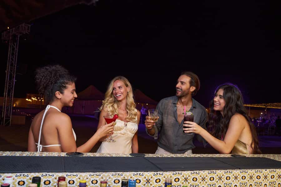 Dubai: Desert Safari, Quad Bike & Premium Camp Experience - Falcons, camels, sweets, and a polished camp