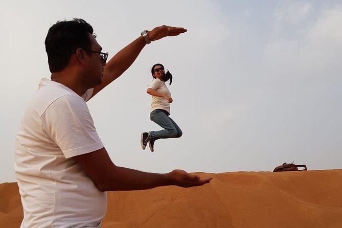 Dubai Desert Safari: Tanoura Show, Dune Bashing and BBQ Dinner - Sandboarding and the desert photo stop