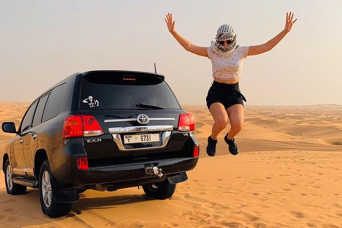Dubai desert safari with 4x4 Dune Bashing,Camel Ride sand board - Red dunes, sharp turns, and a busy evening