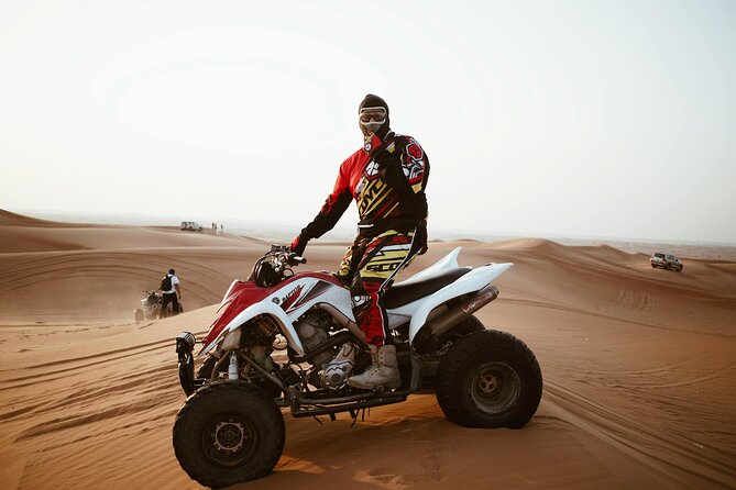 Dubai Desert Safari with BBQ Dinner and Live Shows - Stop one offers quad bikes, but they cost extra