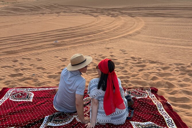 Dubai Desert Safari with Camel Ride, Sand surf, & BBQ Dinner - Red dunes, a photo stop, and sandboarding