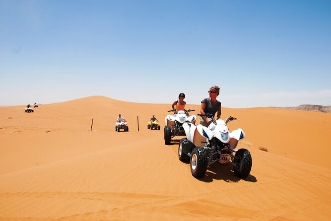 Dubai Desert Safari with Camel Riding, Sand Boarding,BBQ Dinner and 3 Live Shows - Camel riding, coffee, dates, and Bedouin touches