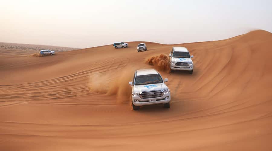 Dubai: Desert Safari with Camp, Dinner, & Optional Overnight - From Dubai hotels to the open dunes